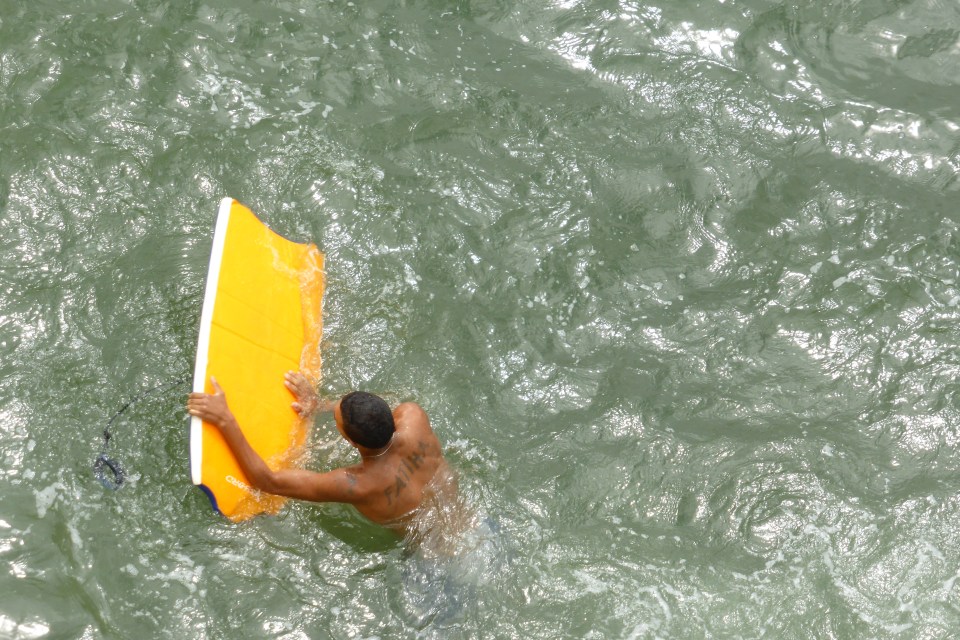 Kids jumping into the sea close to the Mosque Hassan II